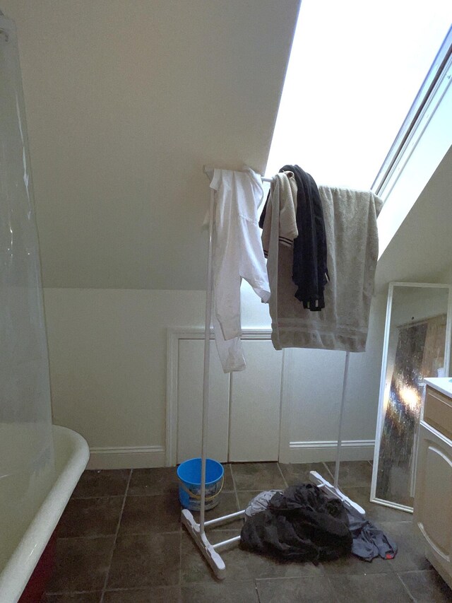 613 Washington Ave, Portland, ME 04103 - bathroom with baseboards and tile patterned flooring