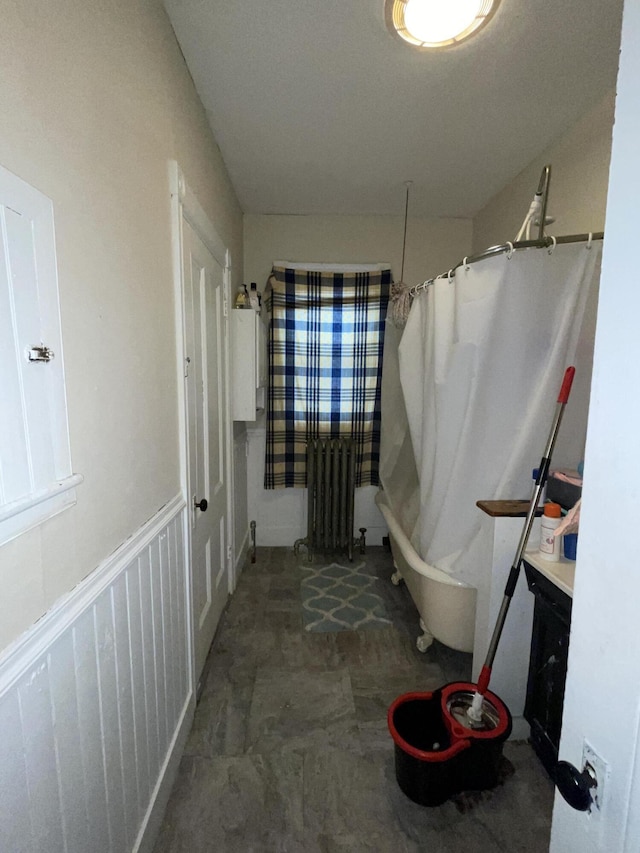 613 Washington Ave, Portland, ME 04103 - bathroom with curtained shower, radiator heating unit, and a bath
