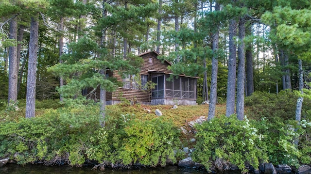 view of yard featuring a sunroom