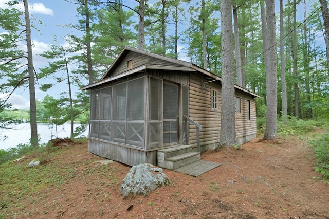 view of outbuilding with a sunroom
