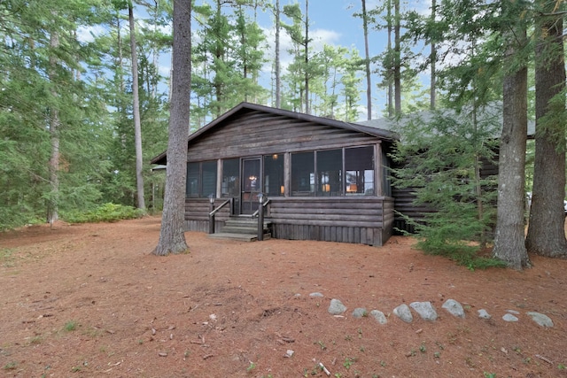 view of front of home with a sunroom