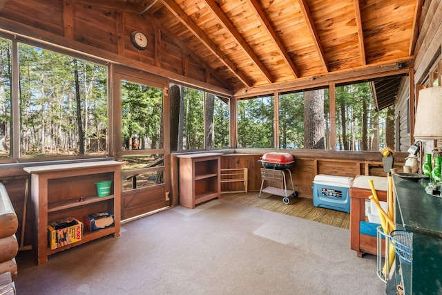 sunroom with lofted ceiling and wood ceiling