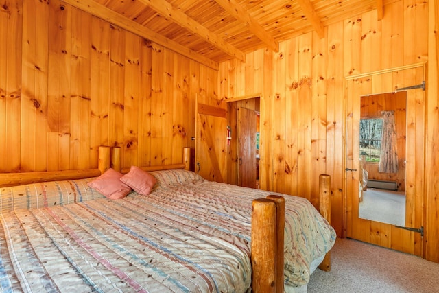 carpeted bedroom featuring beam ceiling, wooden ceiling, wood walls, and a baseboard radiator