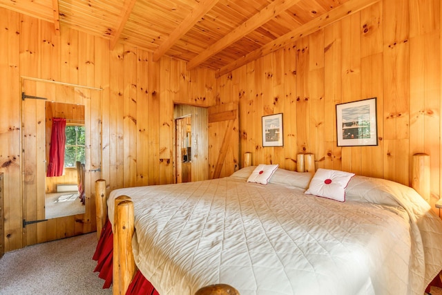 bedroom featuring wood ceiling, beamed ceiling, carpet floors, and wooden walls
