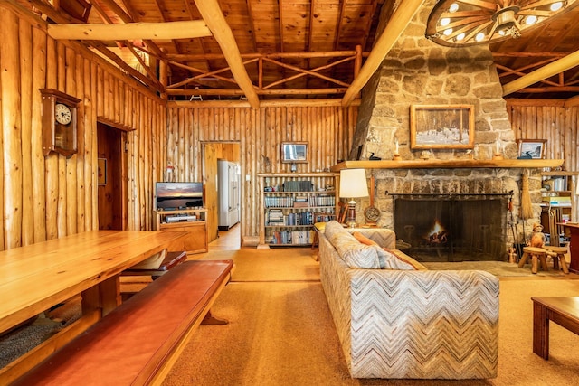 carpeted living area featuring wood ceiling, wood walls, a fireplace, and beamed ceiling