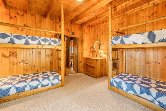 carpeted bedroom featuring wooden walls, wood ceiling, and beamed ceiling