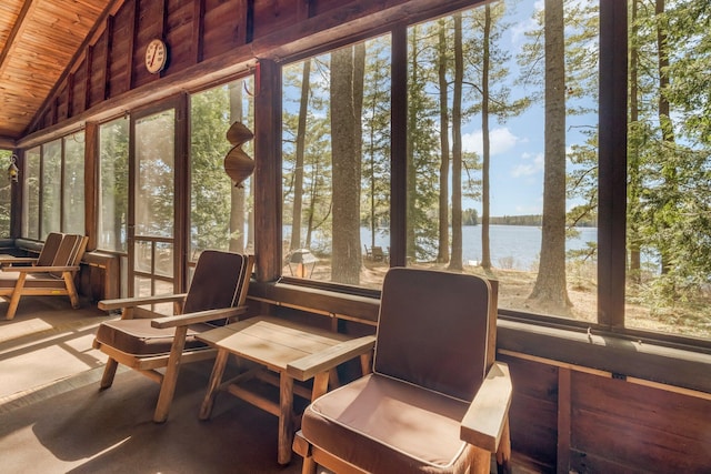 sunroom / solarium featuring wood ceiling, a water view, and lofted ceiling