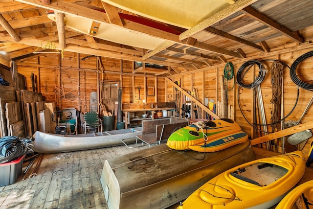 garage featuring wooden walls