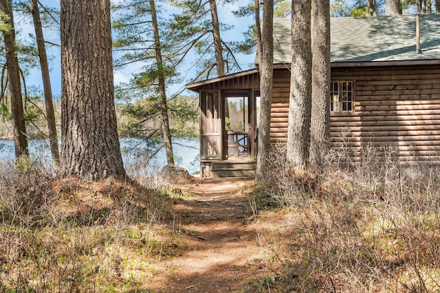 view of outbuilding with a water view