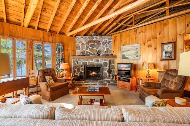living room featuring wooden walls, a fireplace, carpet, and wood ceiling