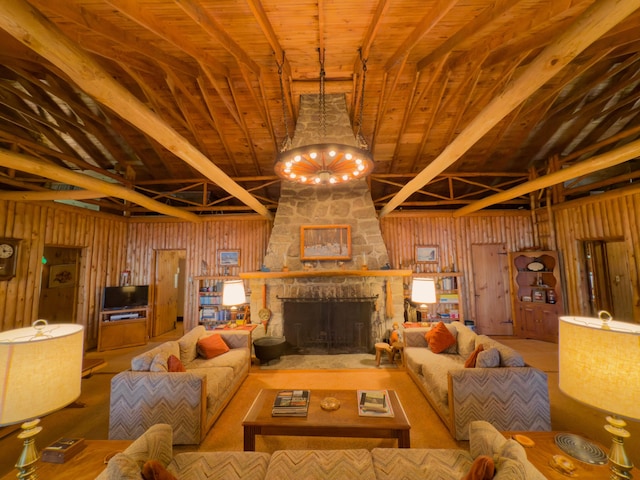 living room featuring a chandelier, a stone fireplace, and wood ceiling