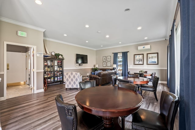 dining space featuring ornamental molding and recessed lighting