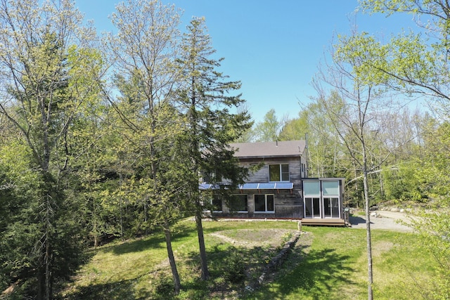 1300 Belfast Rd, Knox, ME 04986 - rear view of house featuring a yard and a sunroom
