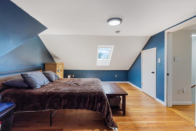 28 Poland Spring Rd, Auburn, ME 04210 - bedroom with vaulted ceiling, light wood-type flooring, baseboards, and a skylight