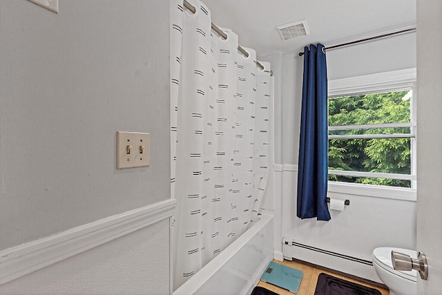 28 Poland Spring Rd, Auburn, ME 04210 - bathroom with a baseboard heating unit, toilet, and shower / bath combo