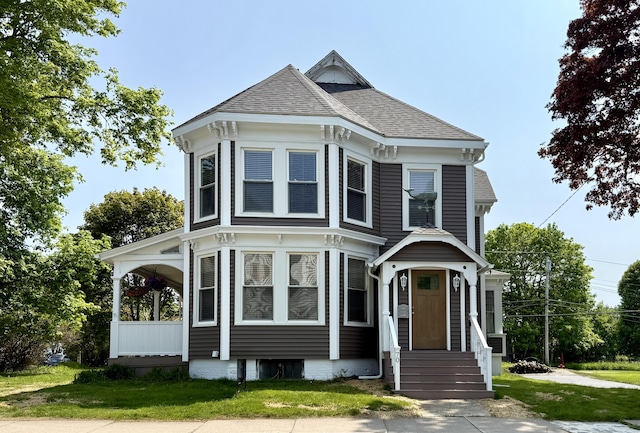 70 Washington St, Eastport, ME 04631 - view of front of house featuring roof with shingles, a front lawn, and entry steps