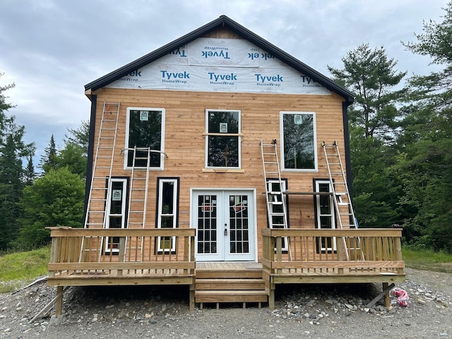 back of house featuring french doors and a deck