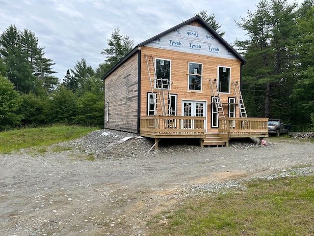 view of front of property with a wooden deck