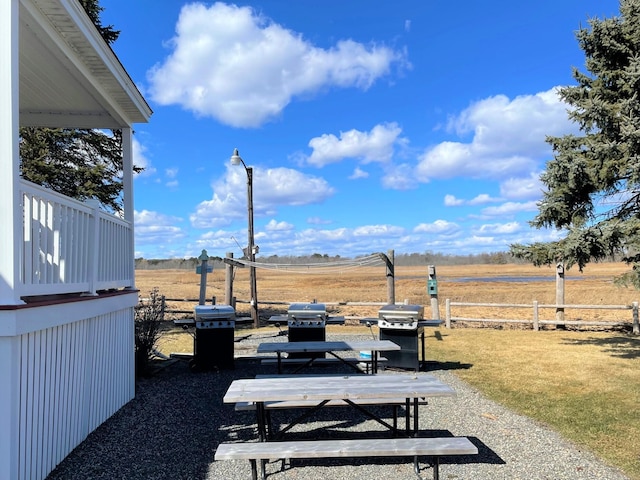 view of yard featuring fence and a rural view