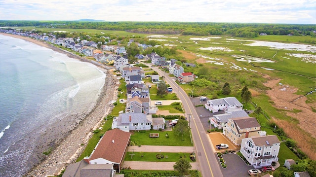 bird's eye view with a water view and a view of the beach