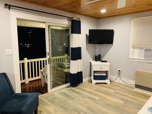 interior space with baseboards, wood finished floors, wooden ceiling, and cooling unit