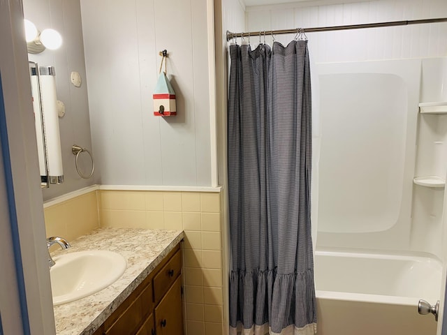 full bathroom with shower / bath combo and vanity
