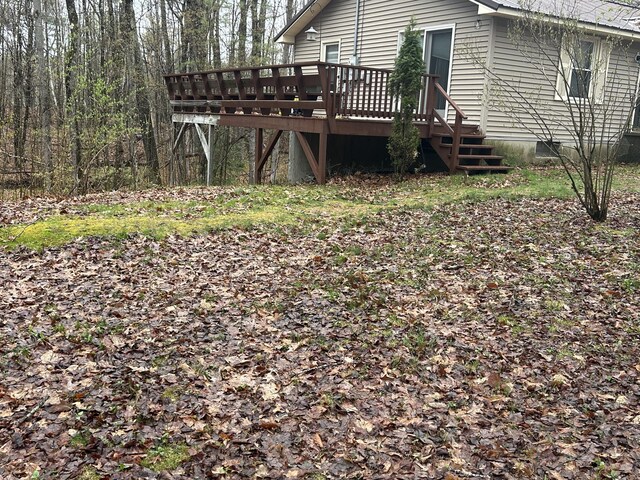 view of yard featuring a wooden deck