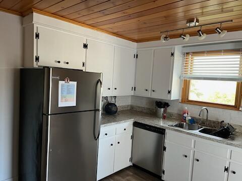 542 Ocean Ave, Wells, ME 04090 - kitchen with wooden ceiling, a sink, stainless steel appliances, and white cabinetry