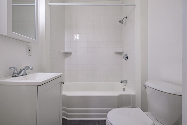 full bath featuring toilet, bathtub / shower combination, and vanity