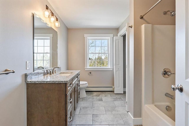full bathroom with toilet, vanity, baseboards, a baseboard heating unit, and shower / bath combination