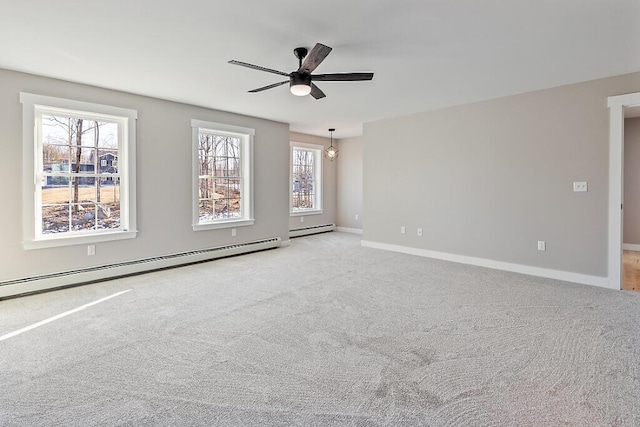 unfurnished room featuring baseboards, carpet floors, a ceiling fan, and baseboard heating