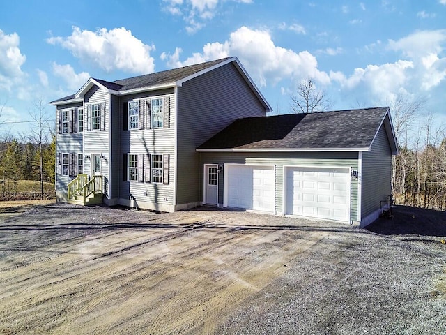 view of front of home featuring driveway and a garage