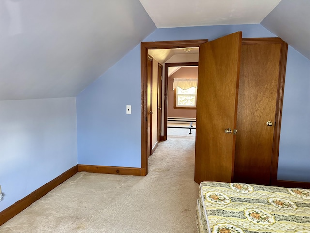 bonus room featuring vaulted ceiling, baseboards, and light colored carpet