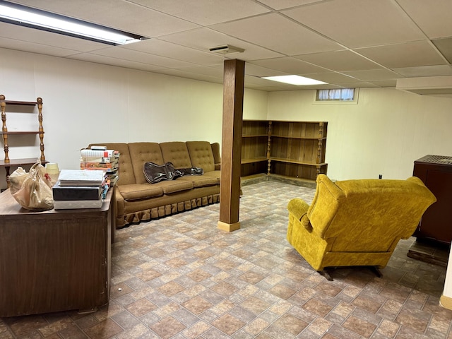 living area featuring visible vents and a drop ceiling