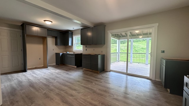 81 Maple Ridge Rd, Harrison, ME 04040 - kitchen with gray cabinetry, light wood-style flooring, and baseboards