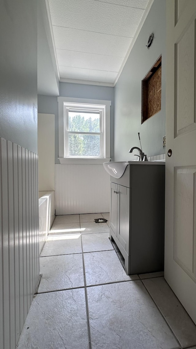 81 Maple Ridge Rd, Harrison, ME 04040 - bathroom featuring vanity, ornamental molding, and wainscoting