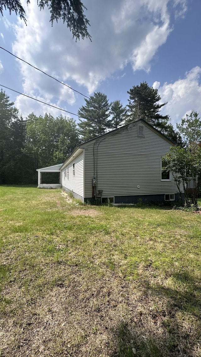 81 Maple Ridge Rd, Harrison, ME 04040 - view of home's exterior with a lawn
