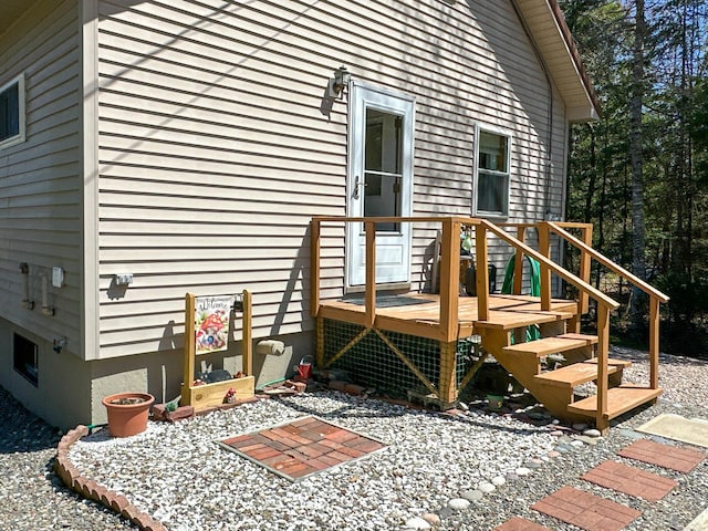 view of property exterior featuring a wooden deck
