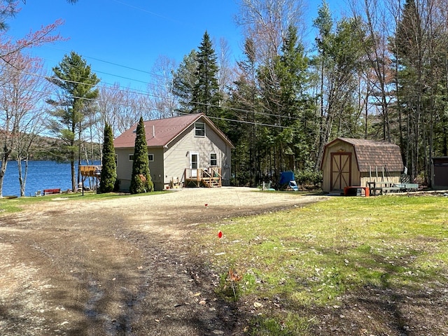 view of yard with an outbuilding and a storage unit