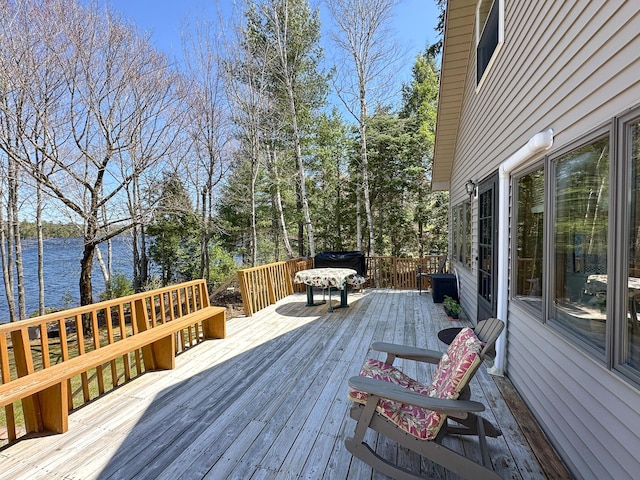 wooden terrace with a water view
