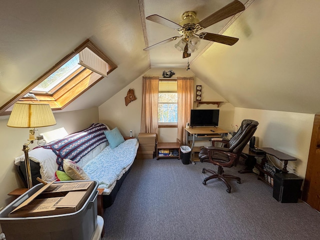 bedroom featuring carpet, lofted ceiling with skylight, and ceiling fan