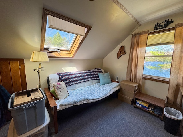 carpeted bedroom featuring lofted ceiling