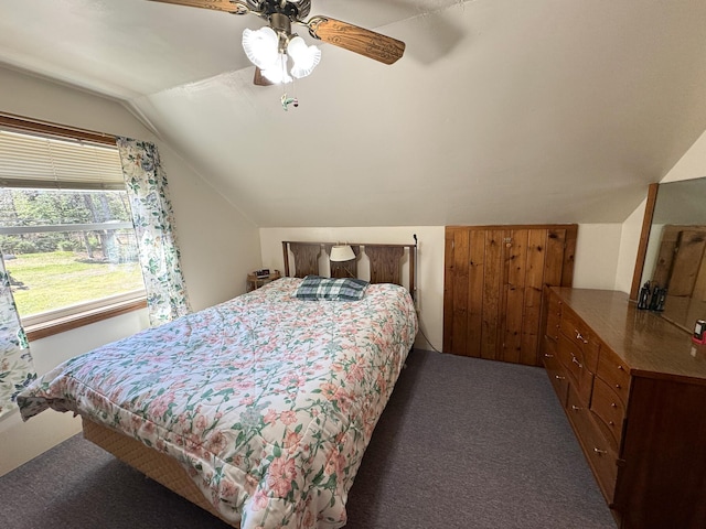 carpeted bedroom featuring ceiling fan and lofted ceiling