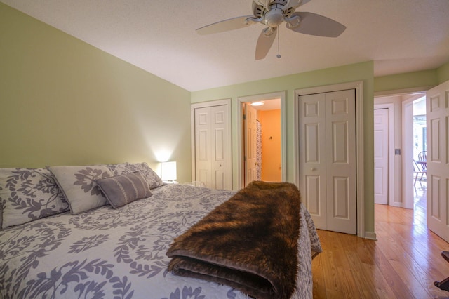 bedroom with light wood finished floors, ceiling fan, lofted ceiling, and baseboards