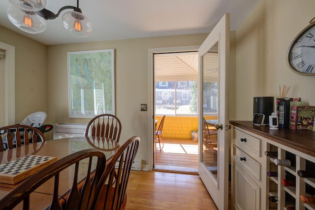 dining space with light wood finished floors