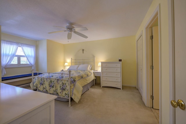 bedroom with light carpet and ceiling fan