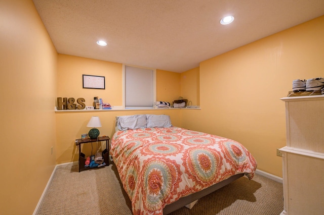 carpeted bedroom featuring recessed lighting and baseboards