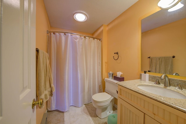 bathroom featuring toilet, tile patterned flooring, vanity, and a shower with shower curtain