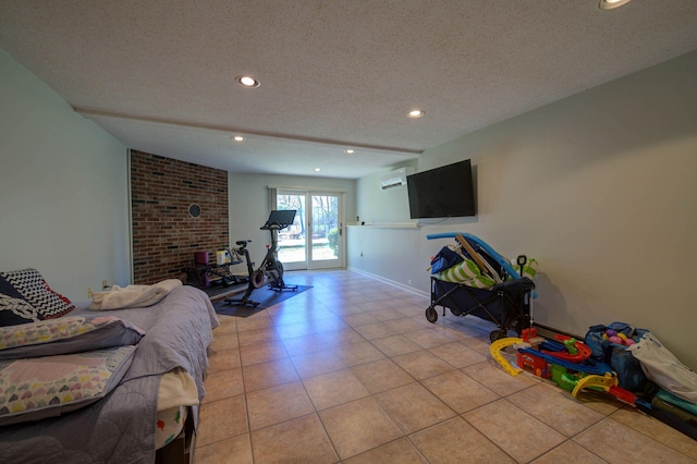 bedroom with recessed lighting, access to exterior, a textured ceiling, and light tile patterned floors