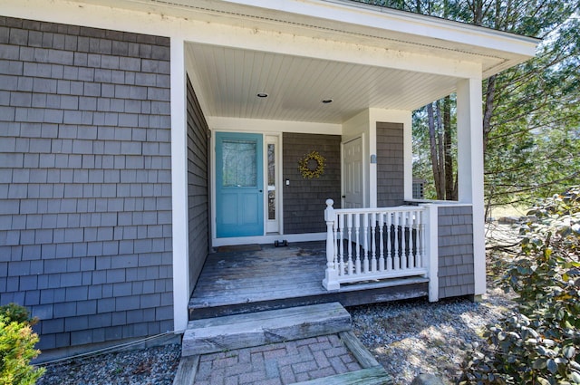 view of exterior entry featuring a porch